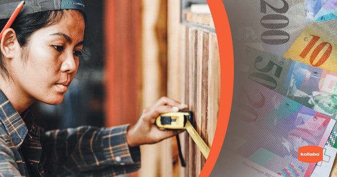 A woman is holding a measuring tape next to a stack of money.